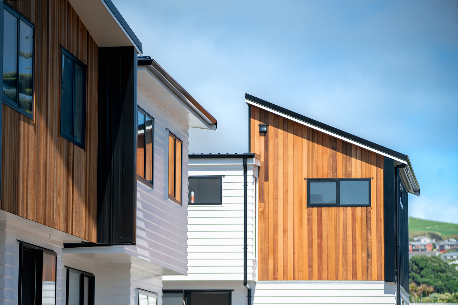Cladding multiple houses