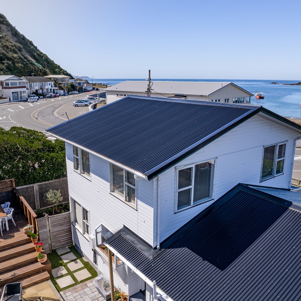 Low aerial shot of a roof in Island Bay